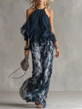 Conjunto elegante de top halter azul marino y pantalón ancho estampado de Ludovica.