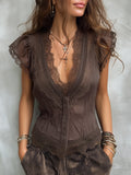 Blusa vintage de Tencel con escote en V y ribete de encaje.