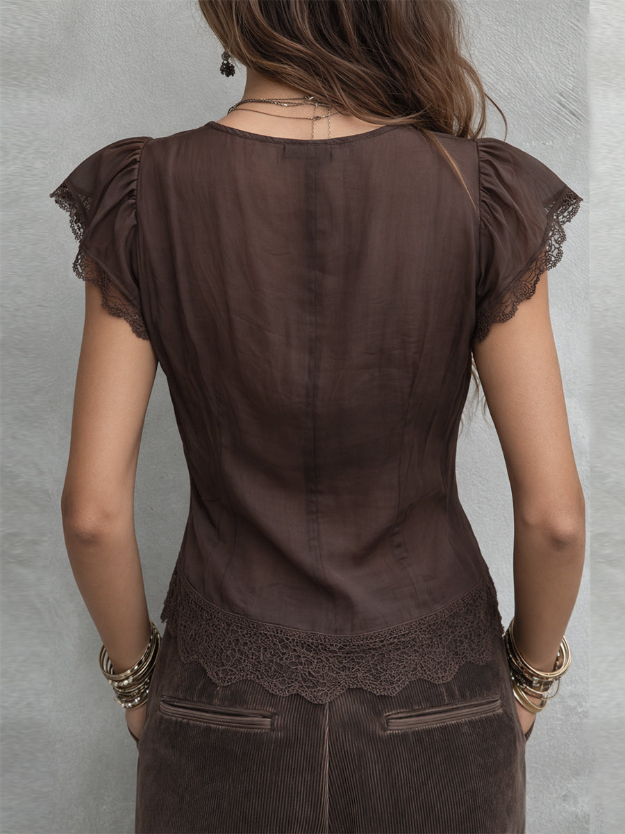 Blusa vintage de Tencel con escote en V y ribete de encaje.