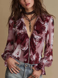 Blusa de gasa con volantes y cremallera frontal, estampado floral color vino vintage.